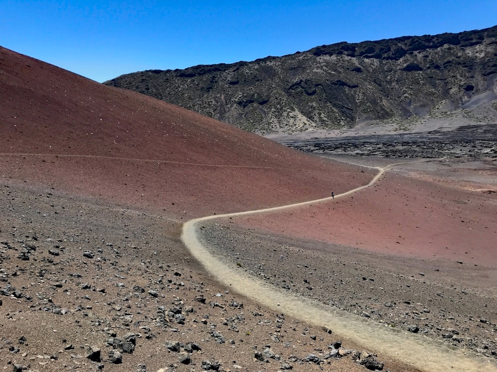 person walking on hill