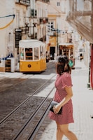 woman crossing the street near cable trains