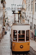 yellow and white train near building