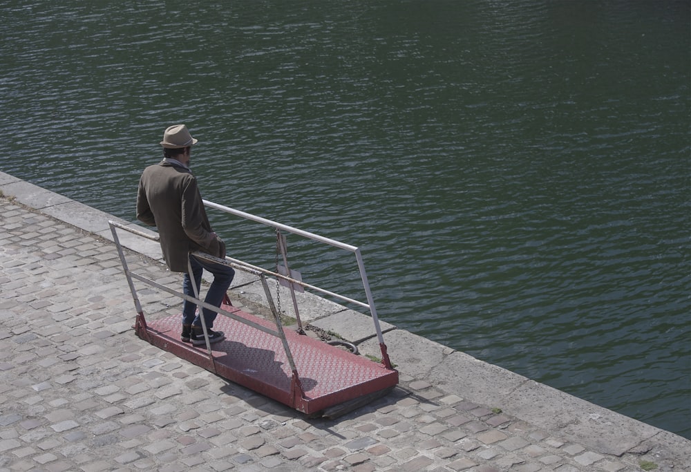 man leaning on railings