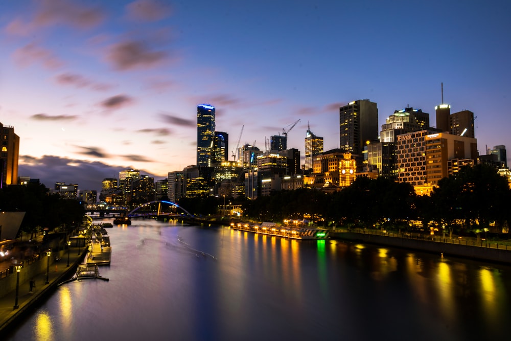 river between buildings during golden hour