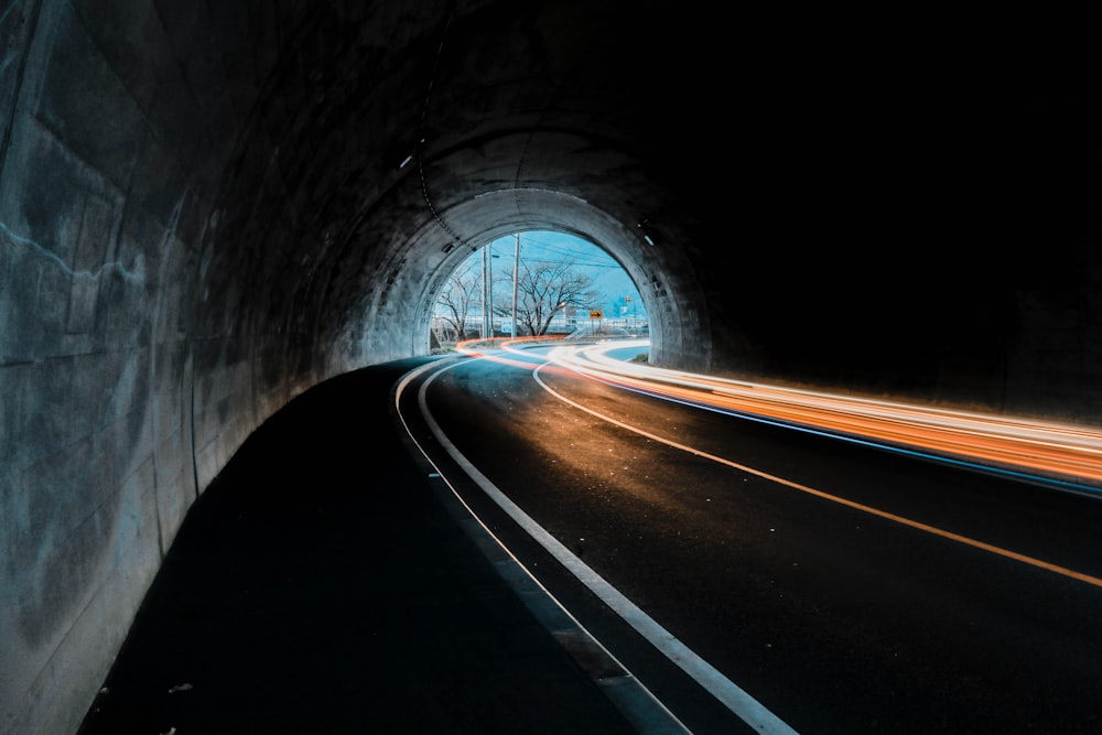 time lapse photography of cars on tunnel