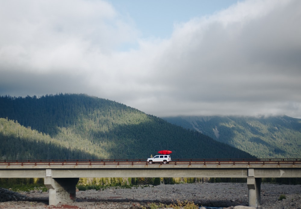 white vehicle on gray bridge