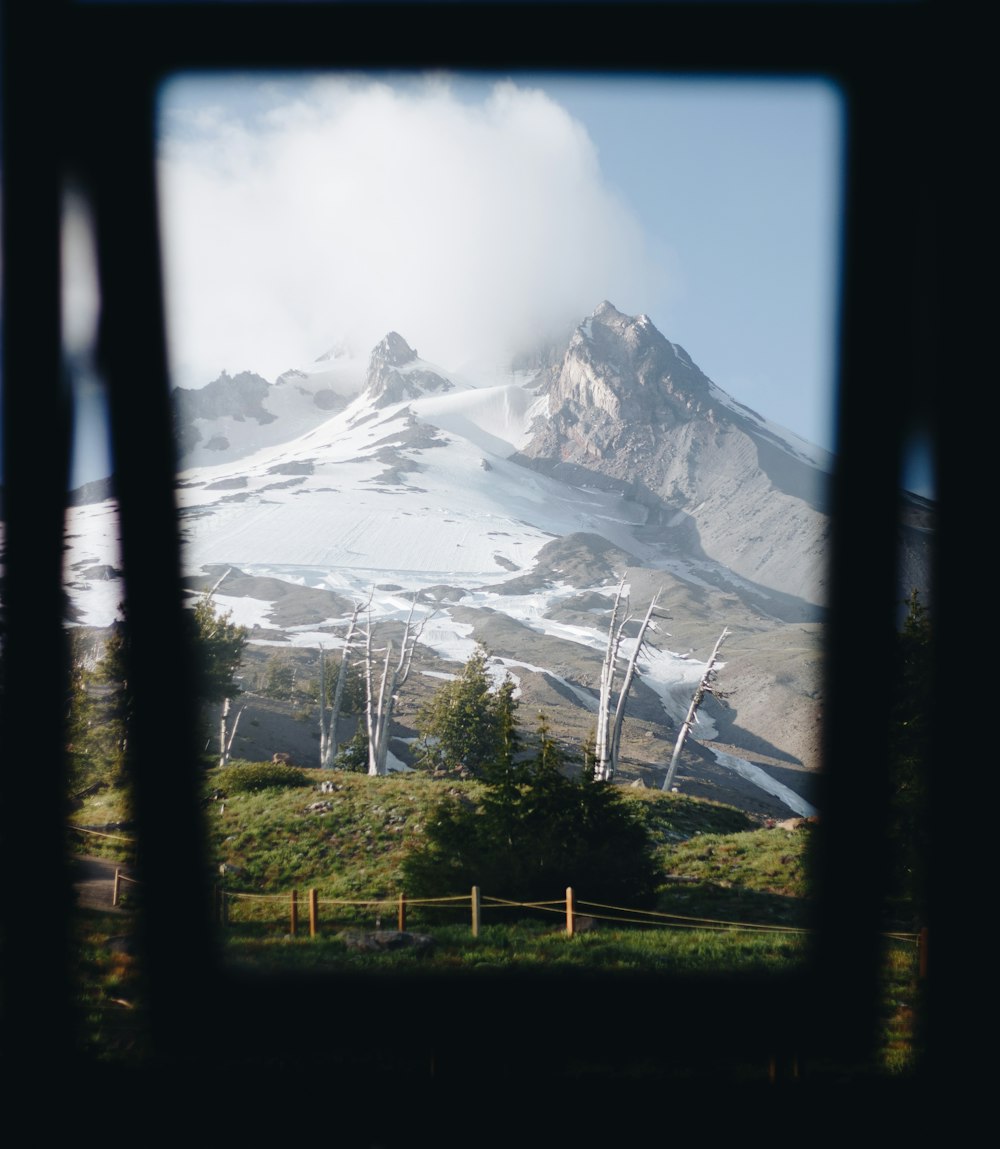 glacier mountain near grass field