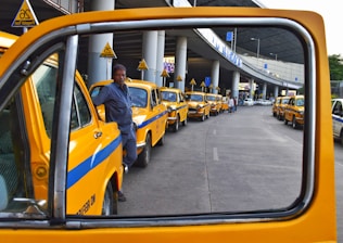 man standing between park vehicles