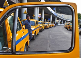 man standing between park vehicles