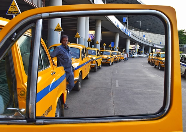 man standing between park vehicles