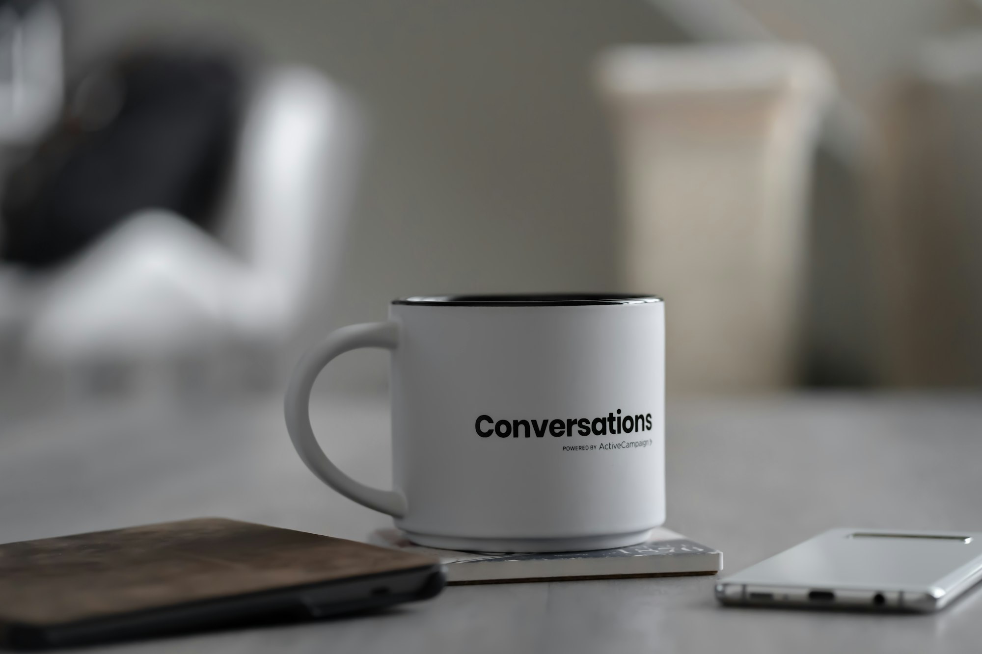 Just a picture of my Conversations mug I received from ActiveCampaign for working on the Android app. Also featured is my Kindle and phone.