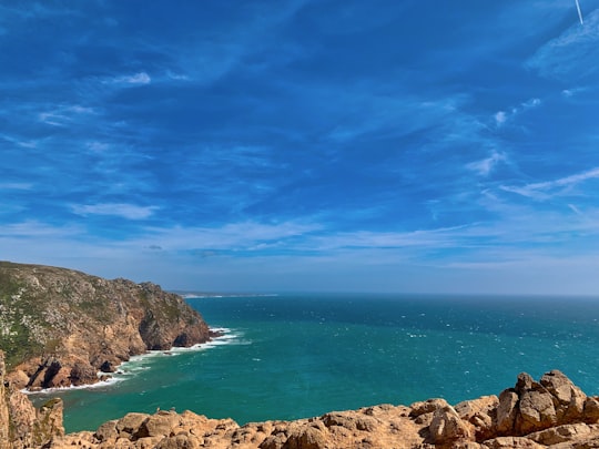 aerial of cliff and body of water in Sintra-Cascais Natural Park Portugal