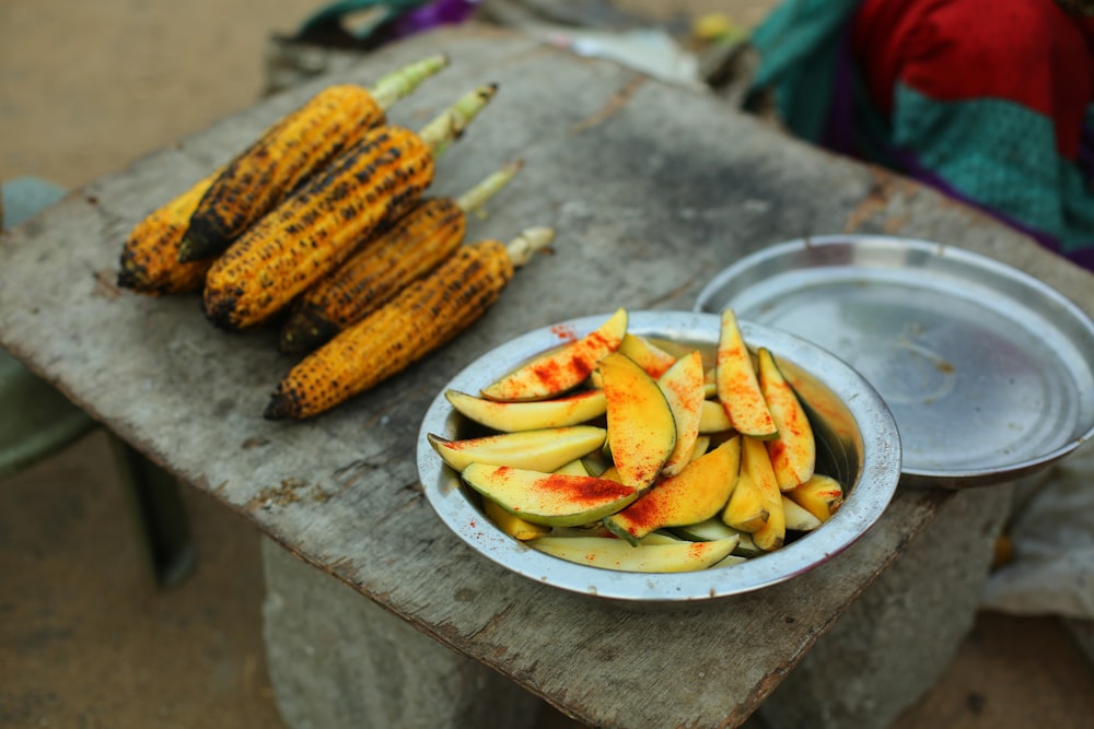 sliced mango and grilled corn