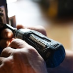 selective focus photography blue and black Makita power drill