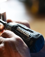 selective focus photography blue and black Makita power drill