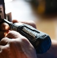 selective focus photography blue and black Makita power drill