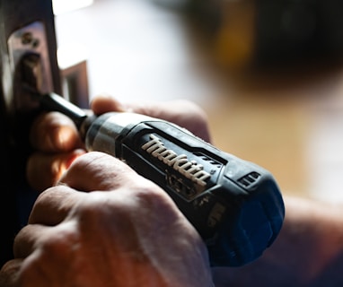 selective focus photography blue and black Makita power drill