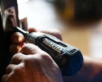 selective focus photography blue and black Makita power drill