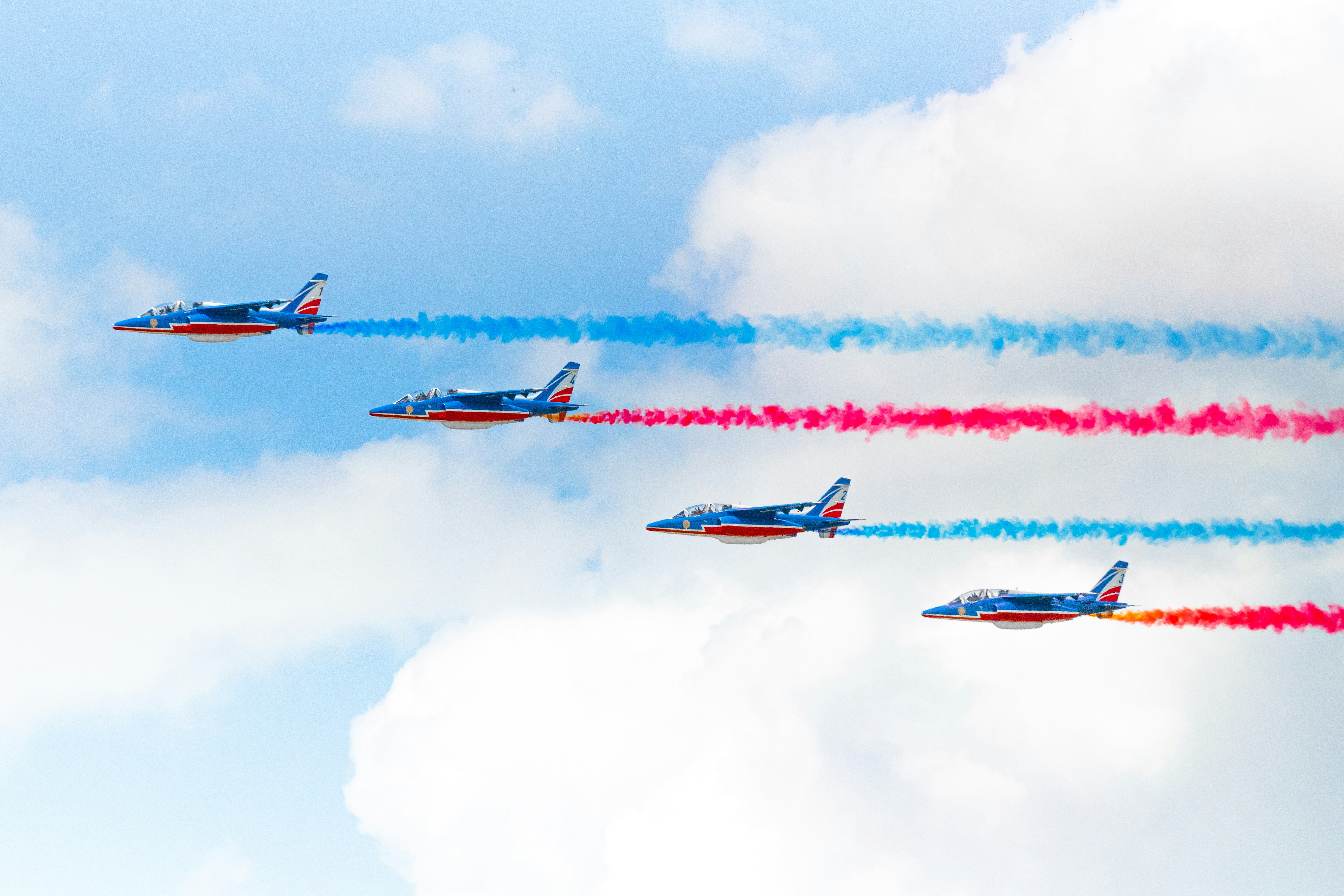 four planes, I took this photo at the Paris Air Show while the Patrouille de France made a flying display. They are just perfect aligned. I