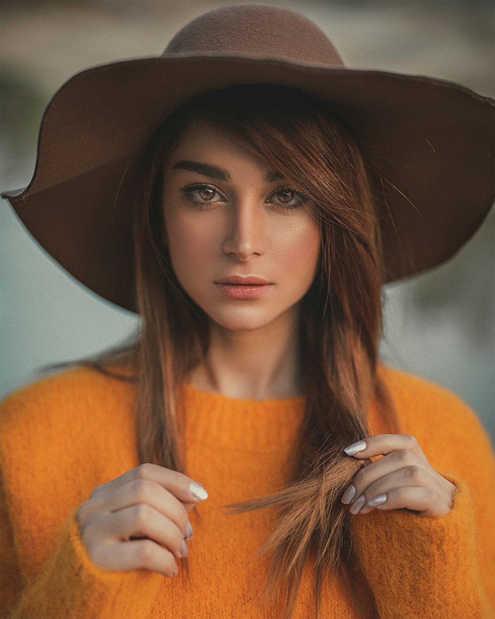woman in orange knit sweater