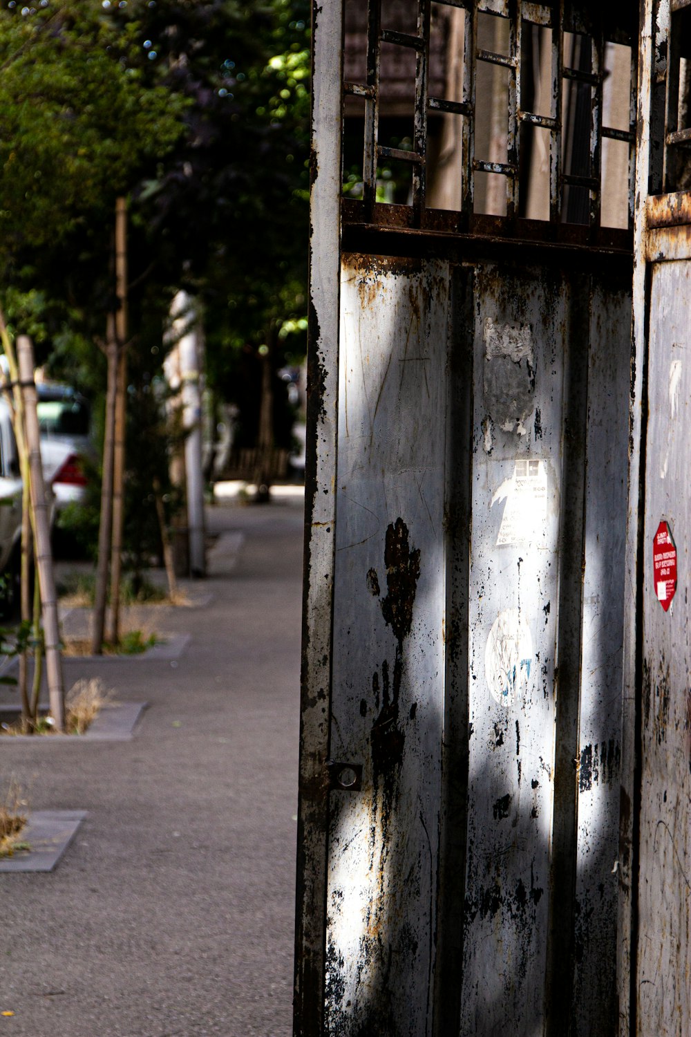 an old door is open on the side of the street