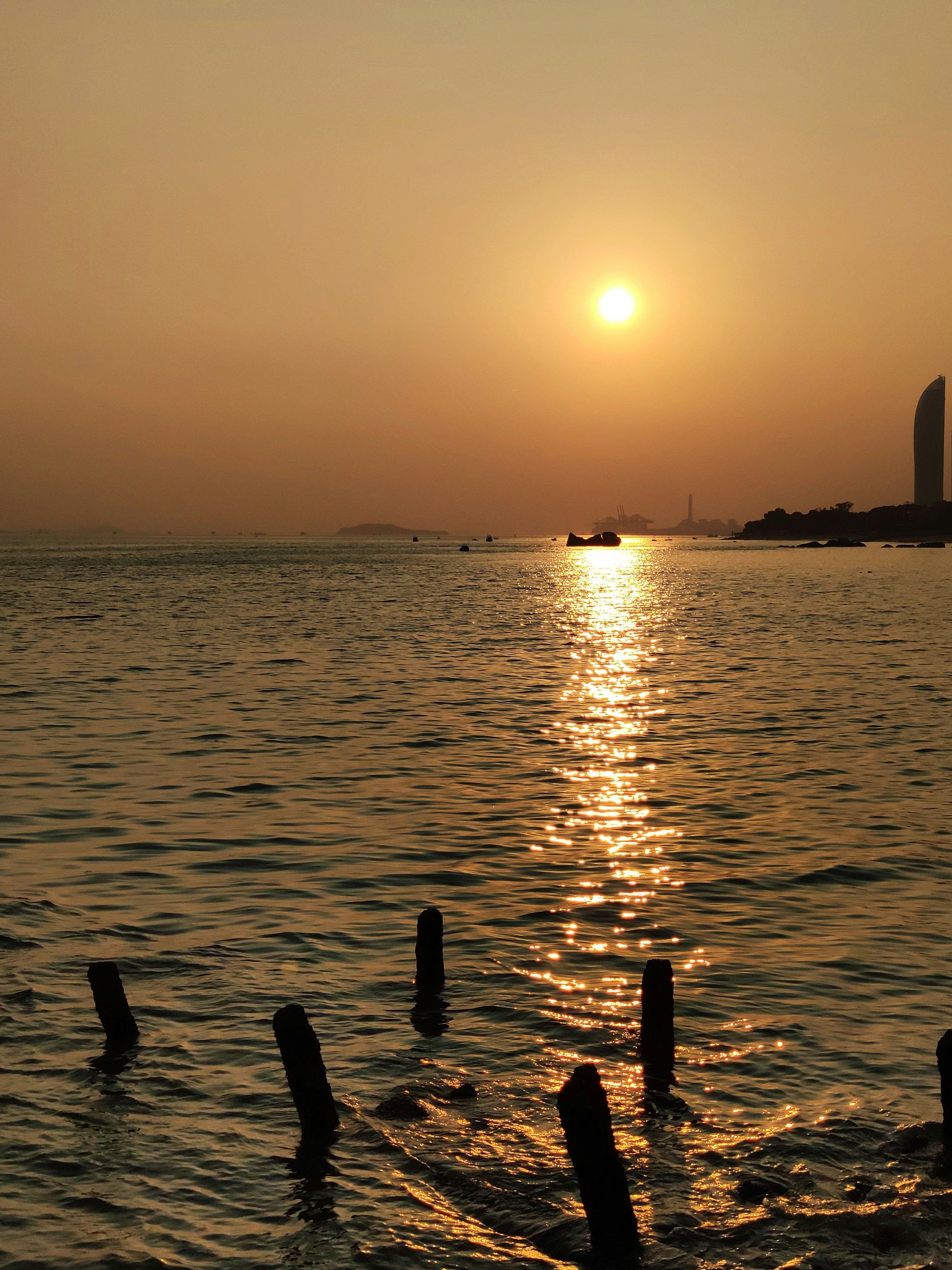 By a broken pier in a popular tourist area of the city of Xiamen