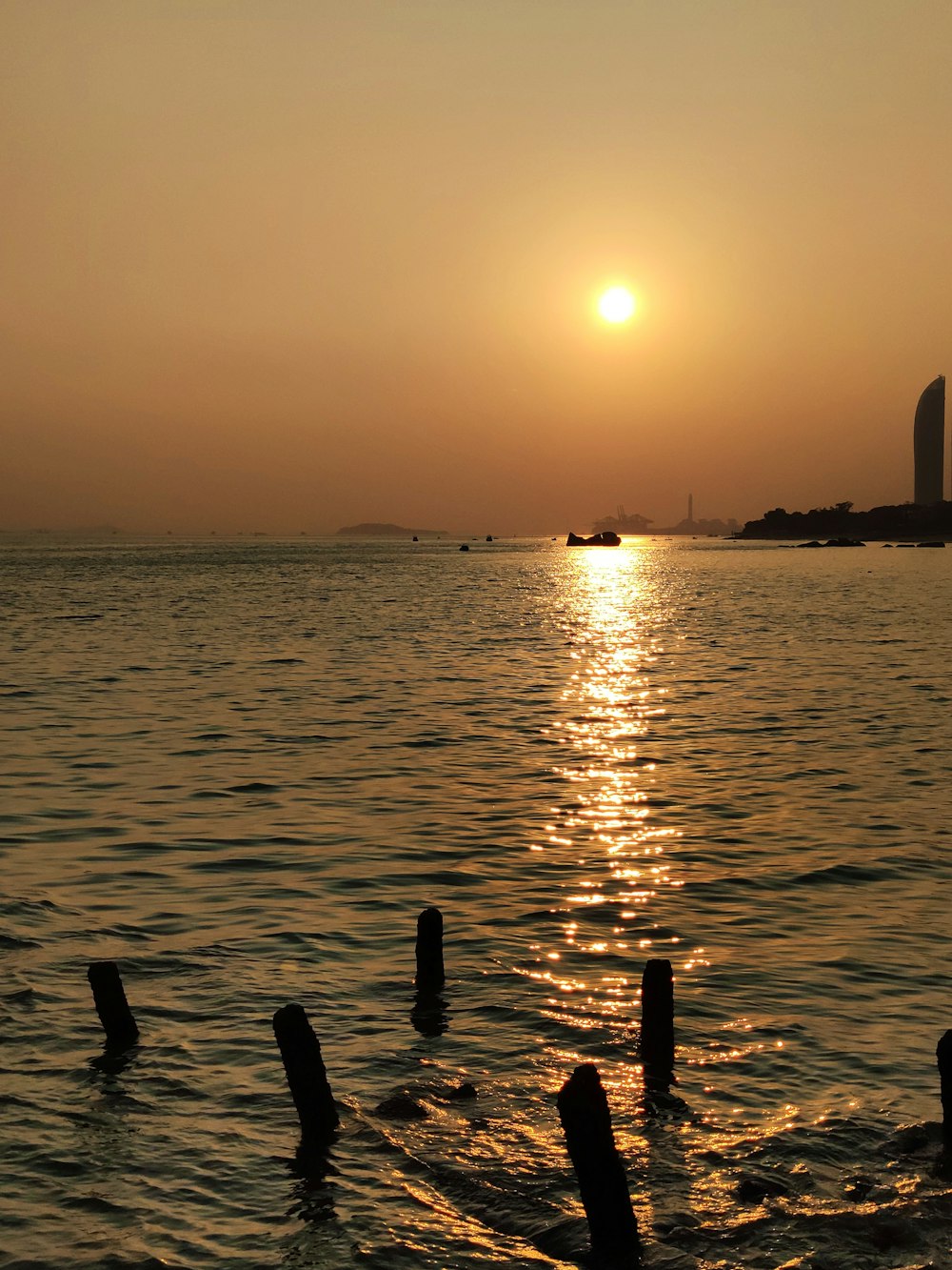 boats at sea at sunset