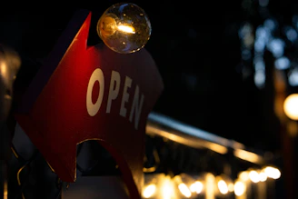 A softly lit sign that reads 'Under Construction' with warm, inviting colors.