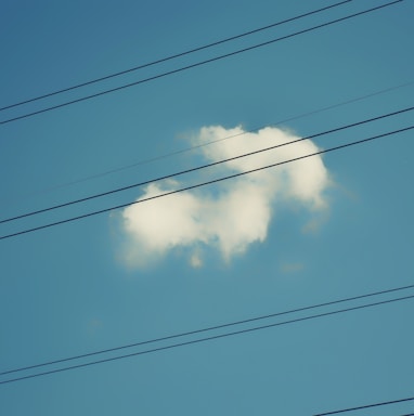 a cloud shaped like a heart on a blue sky