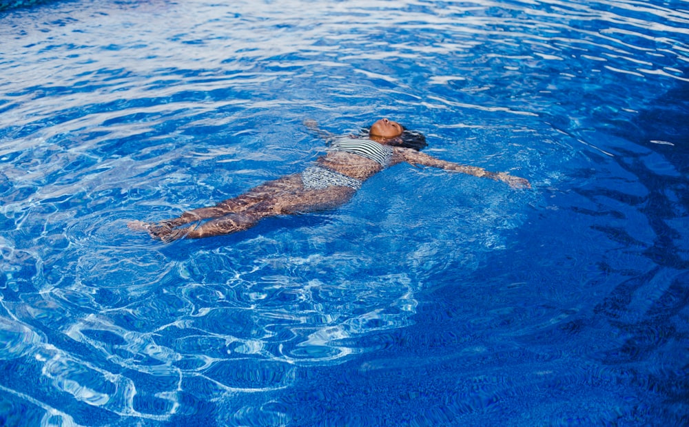 woman swimming on pool