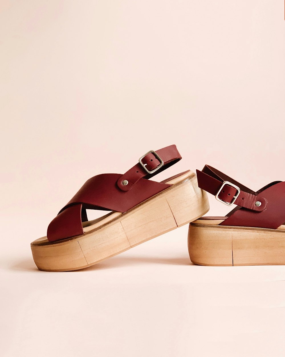 pair of maroon wedges