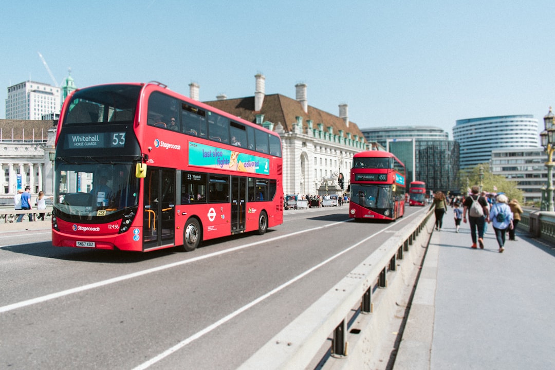 red buses on road