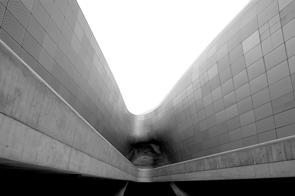 a black and white photo of a subway tunnel