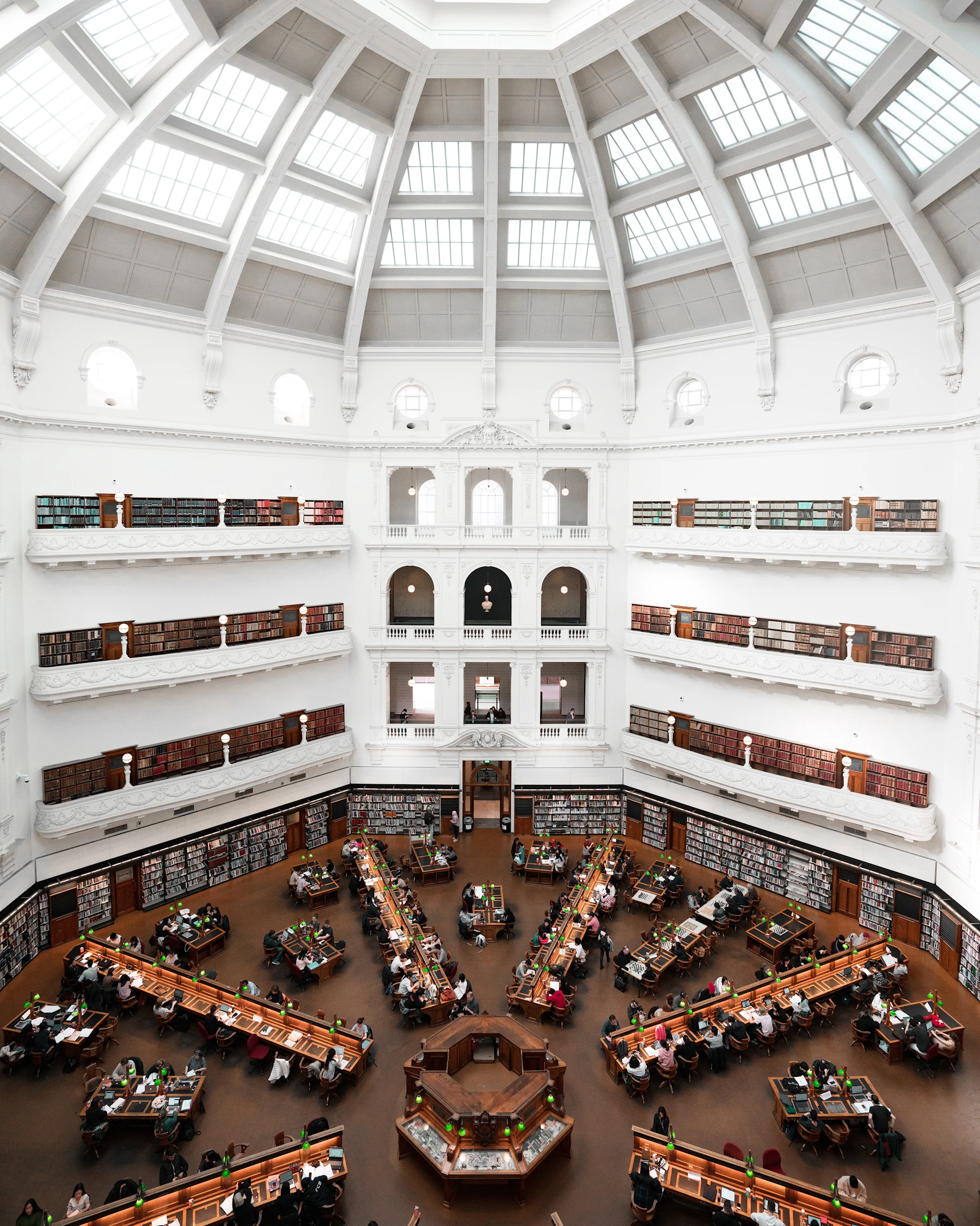 People reading and gathering inside a library