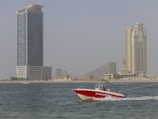 white and red speedboat