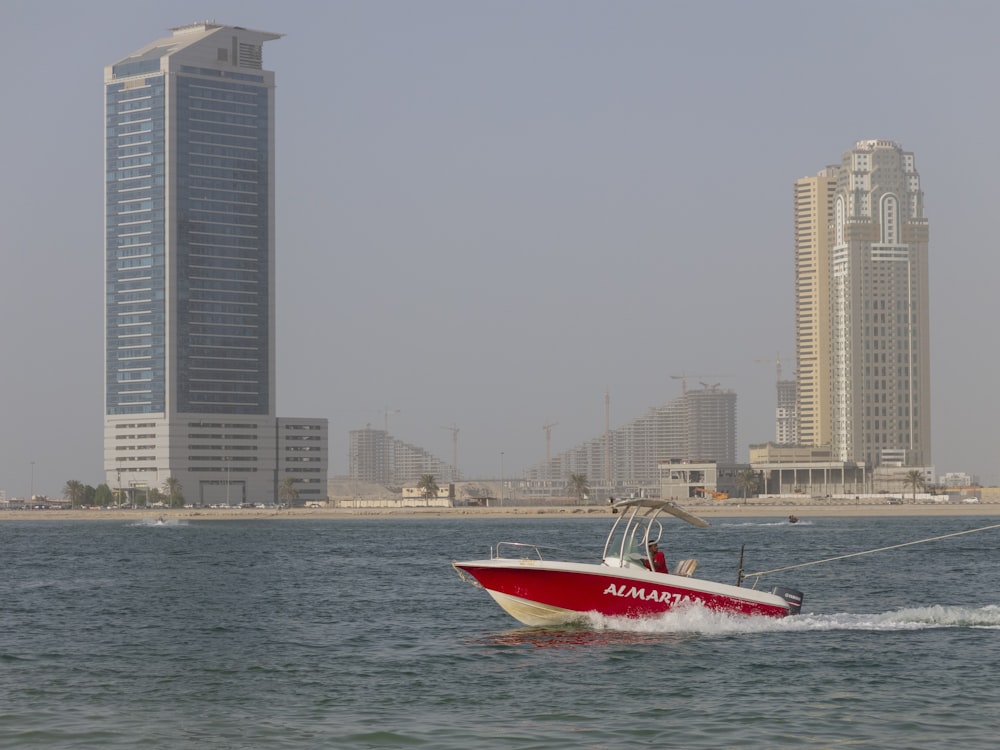 white and red speedboat