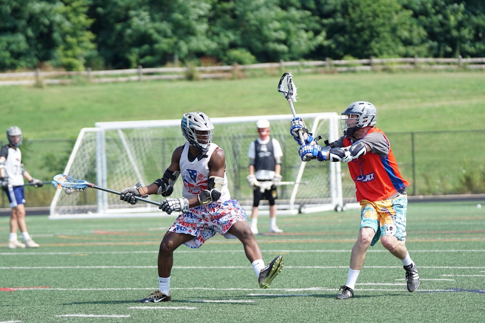 people playing on grass field