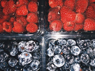 Close-up of frozen fruit pulp packages with vibrant labels