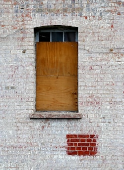 closed brown wooden window