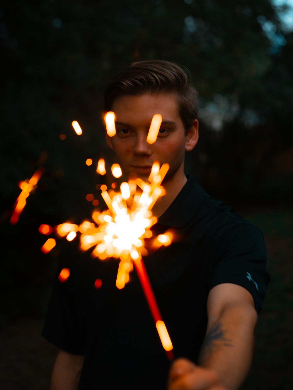 man holding sparkler