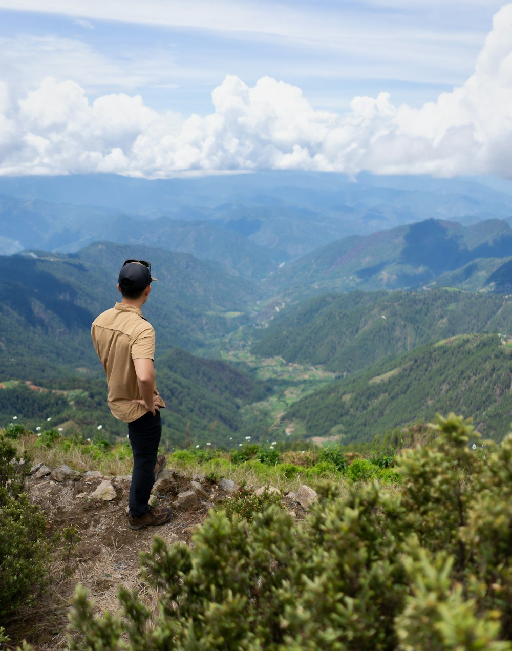 man standing on hill