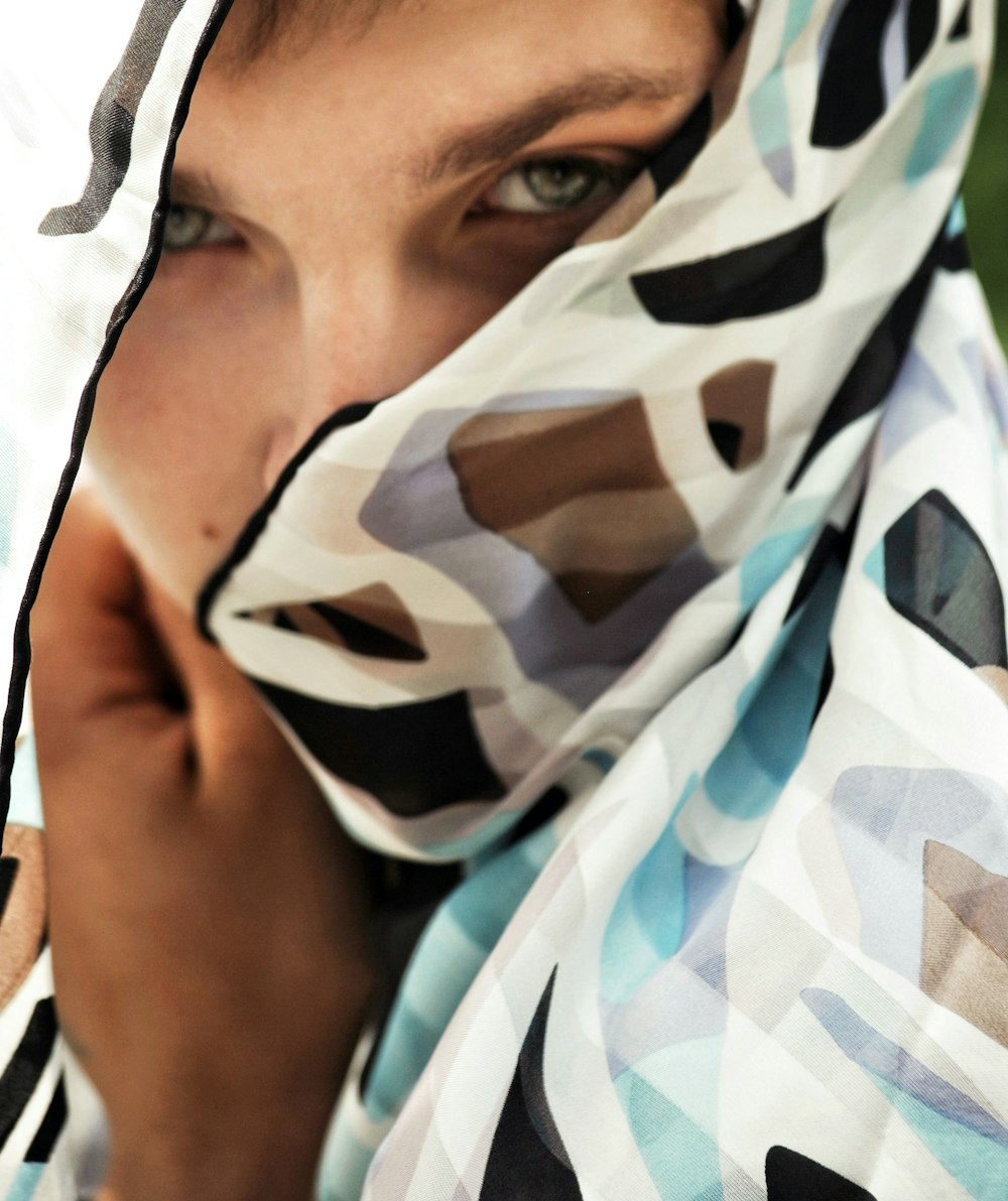 white, brown, black and blue scarf