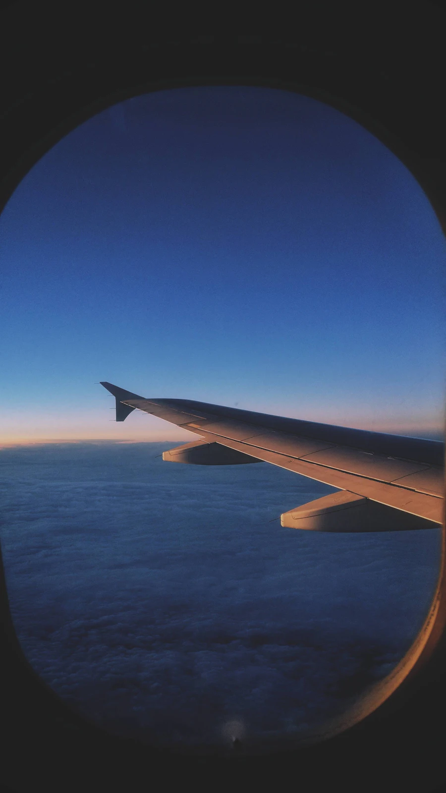 Airplane flying above the clouds