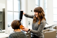 woman holding hair dryer