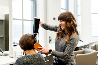 woman holding hair dryer