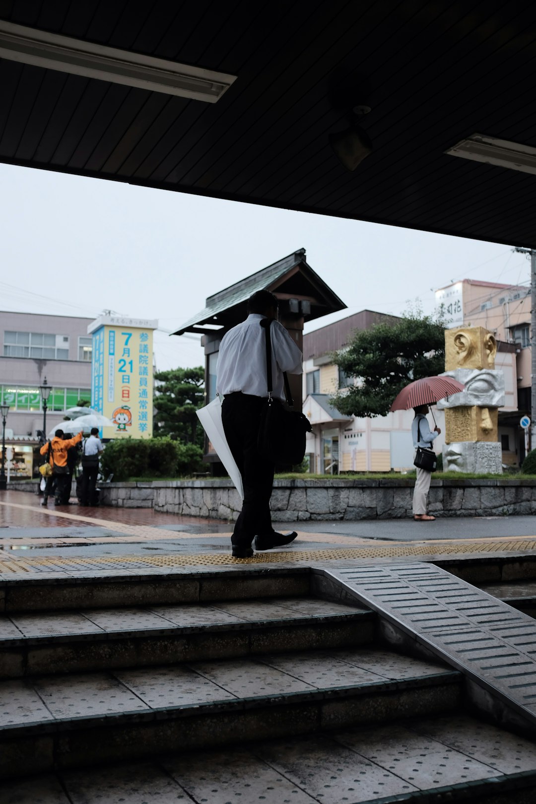 man holding white umbrella