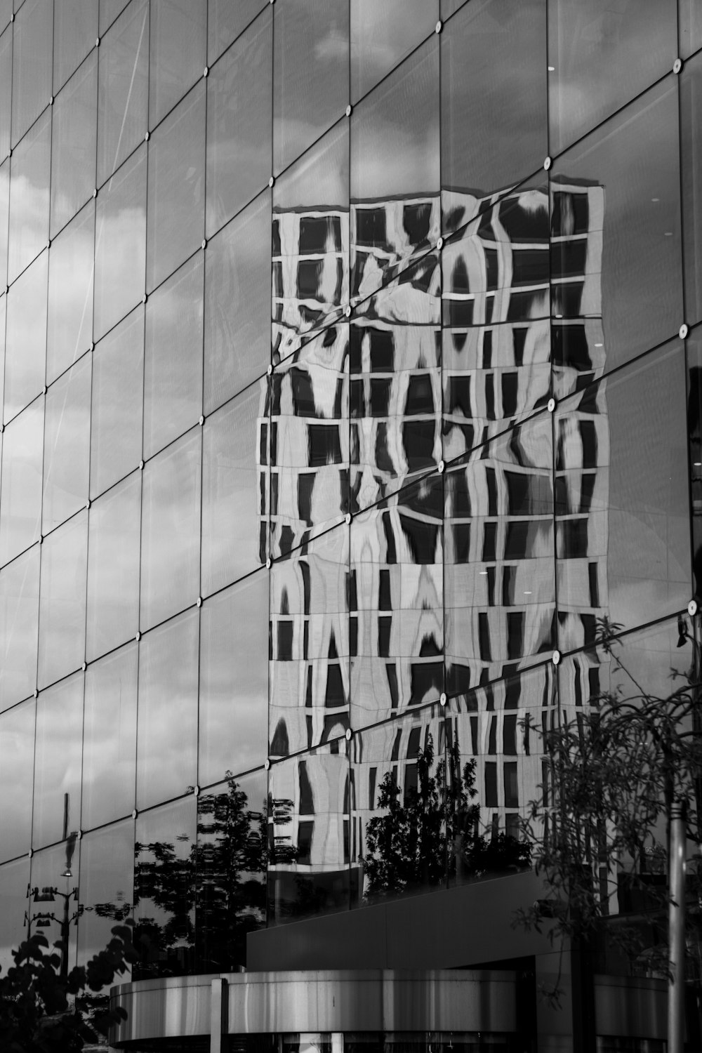 grayscale photo of a glass building