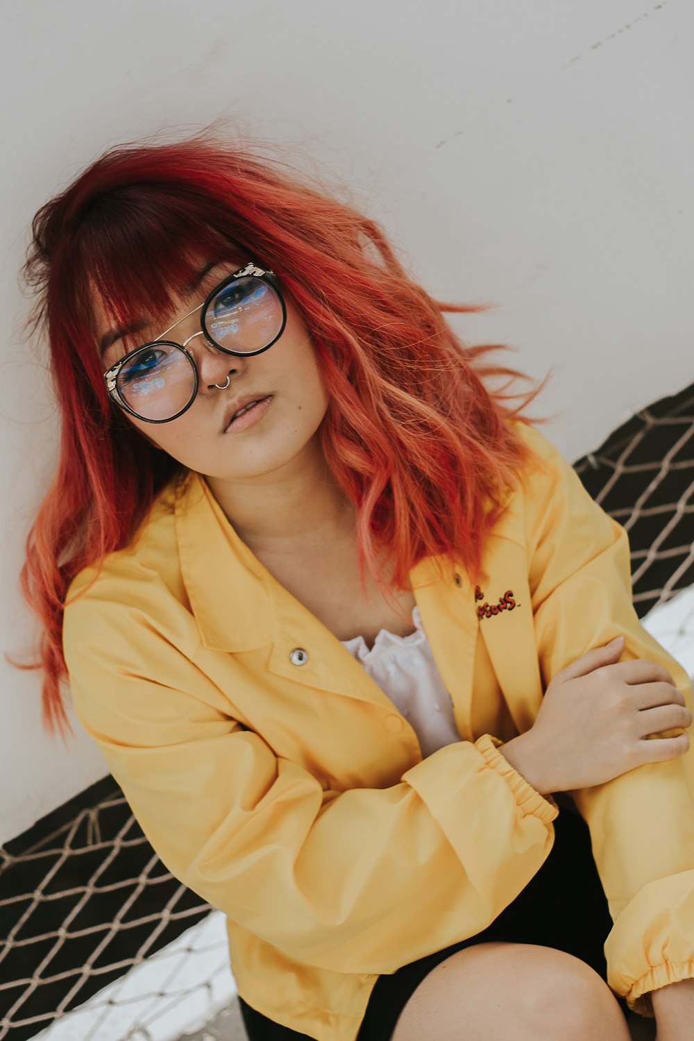 women wearing a black framed eyeglasses close-up photography