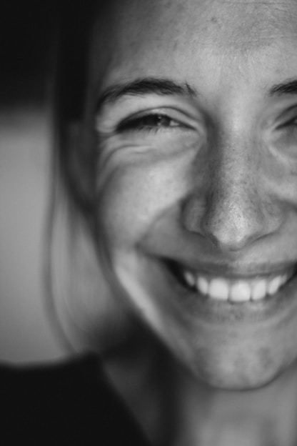 woman smiling because of her entrepreneur's operating system
