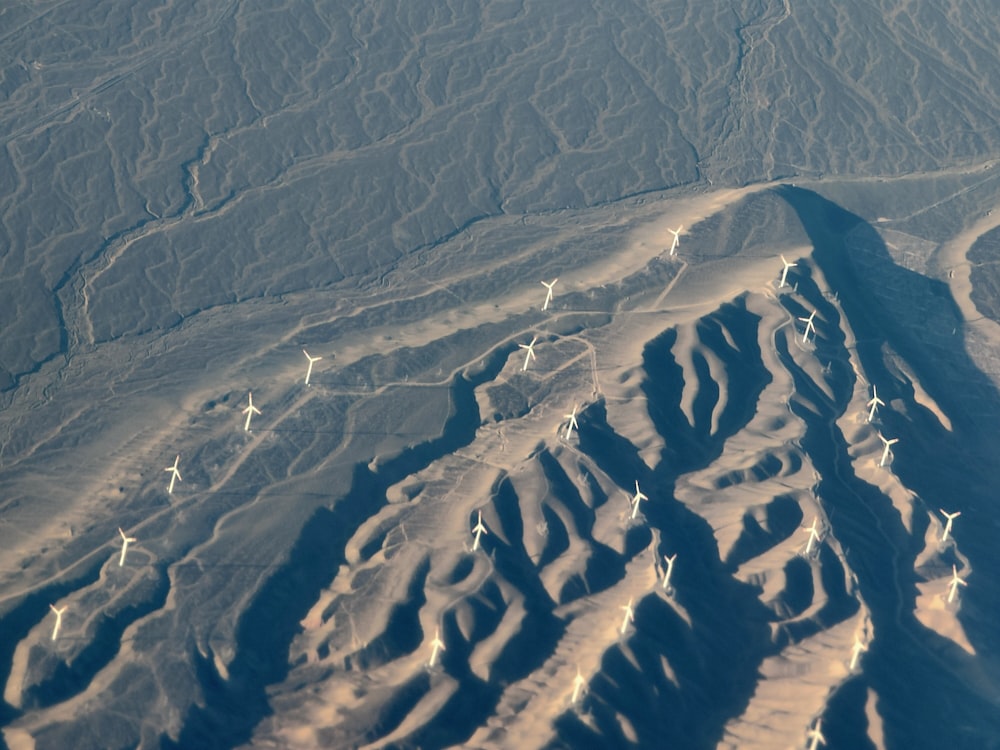 white windmill lot in a mountain during daytime