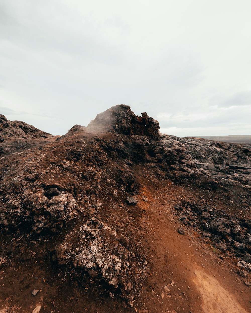 a pile of dirt sitting on top of a dirt field