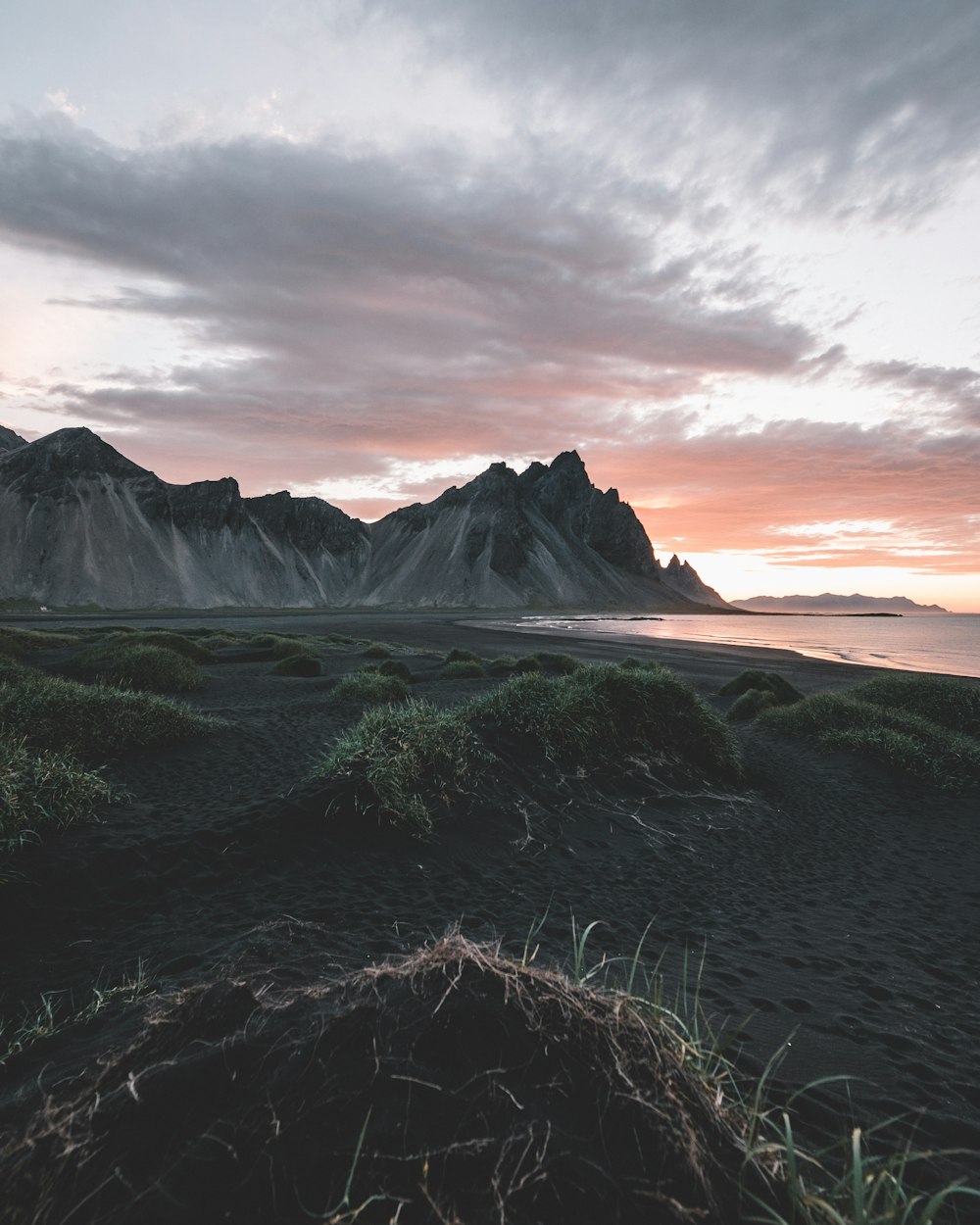 black sand beach with cliff