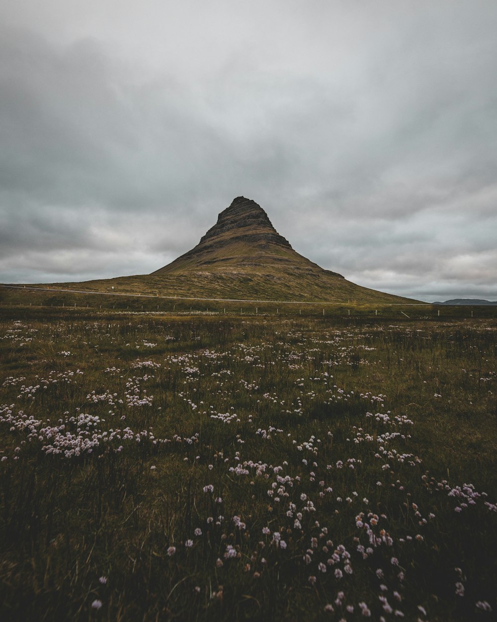 brown rock mountain under white clouds